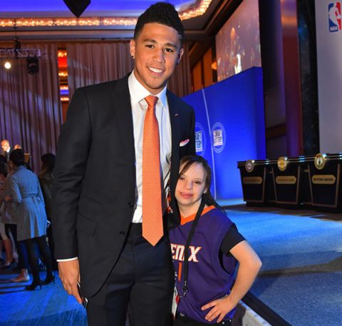 Devin Booker poses a picture with half-sister Mya Powell.